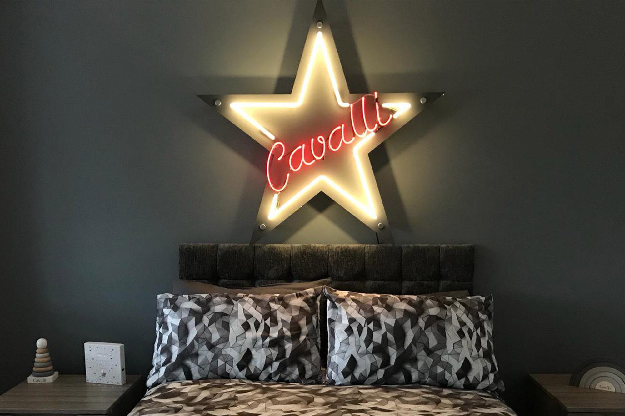 Cavalli' white and purple neon sign. Real glass neon sign mounted on to silver acrylic panel cut to shape.