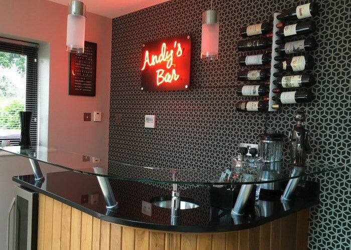Andy's Bar' amber neon sign. Real glass neon fitted directly onto satin black acrylic panel.