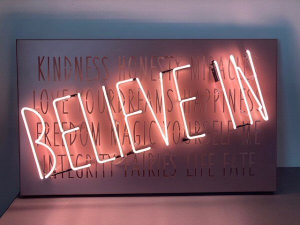 BELIEVE IN' pink neon light. Real glass neon fitted onto fret cut, powder coated metal tray.