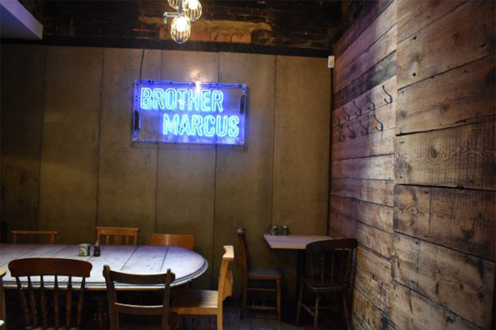 BROTHER' blue neon sign. Real glass neon fitted onto clear acrylic panel.