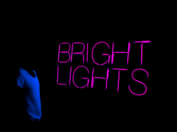 BRIGHT LIGHTS' UV neon. Real glass neon fitted onto a black acrylic panel.