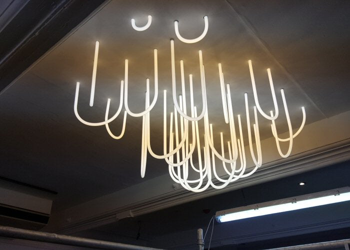 SoLita Chandelier' white neon artwork. Real glass neon fitted directly on to the ceiling.
