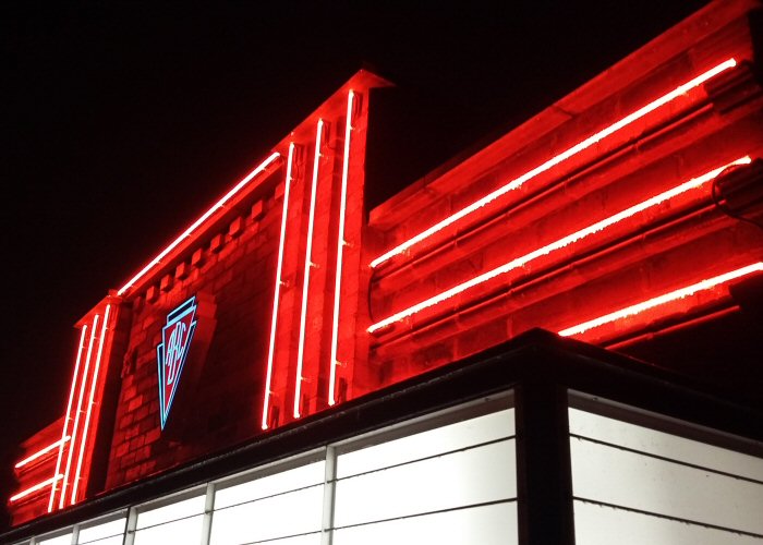 Cinema straights' red neon lights. Real glass neon fitted directly onto building fascia.