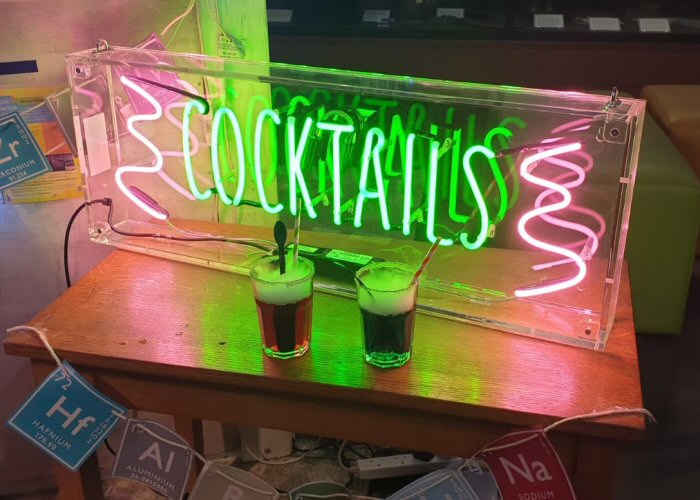 COCKTAILS' green and pink neon sign. Real glass neon fitted inside clear acrylic case.