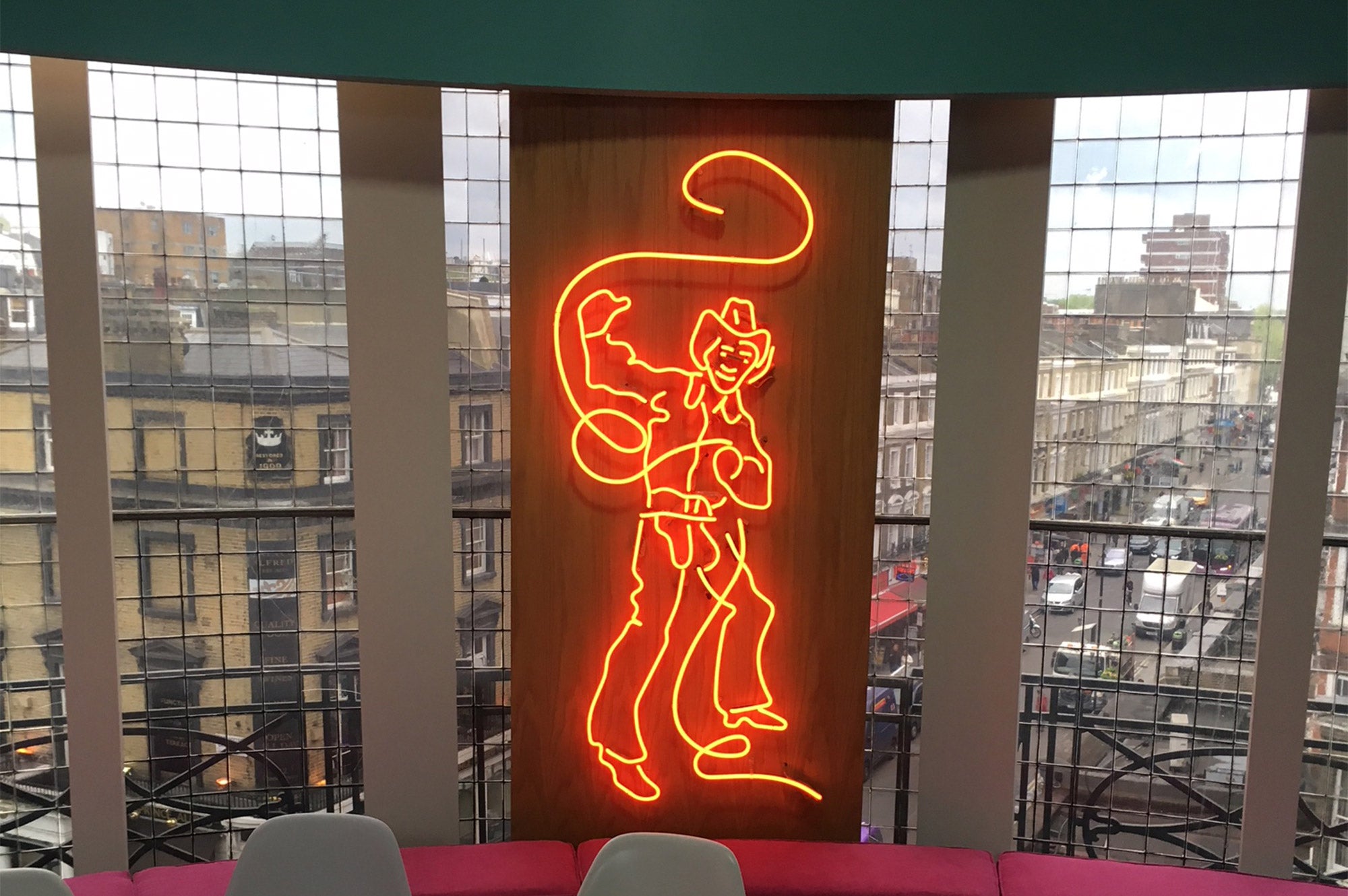 Cowboy' neon sign. Real glass neon fitted inside acrylic case with a black back.