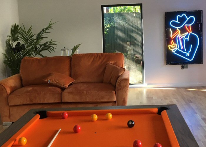 Cowboy' neon sign. Real glass neon fitted inside acrylic case with a black back.