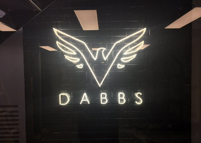 DABBS' white neon sign. Real glass neon fitted directly onto the wall.
