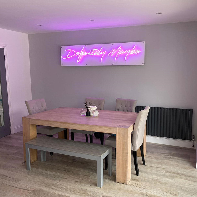 Definitely Maybe' purple neon sign. Real glass neon on a satin white acrylic panel.