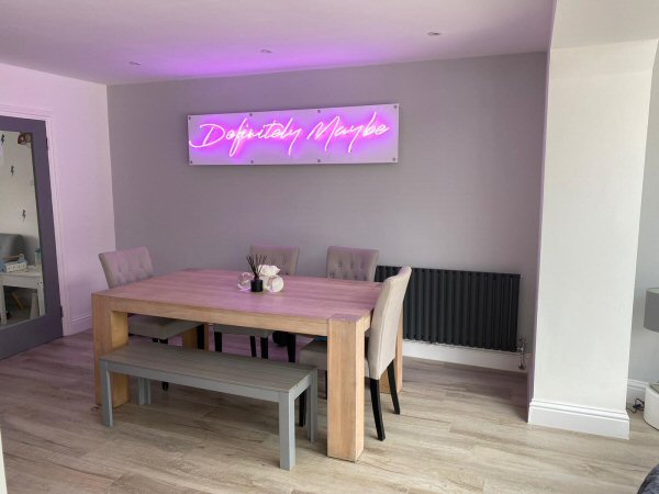 Definitely Maybe' purple neon sign. Real glass neon on a satin white acrylic panel.