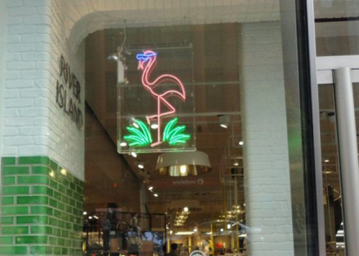 Flamingo with shades' pink and green neon sign. Real glass neon fitted inside clear acrylic case.
