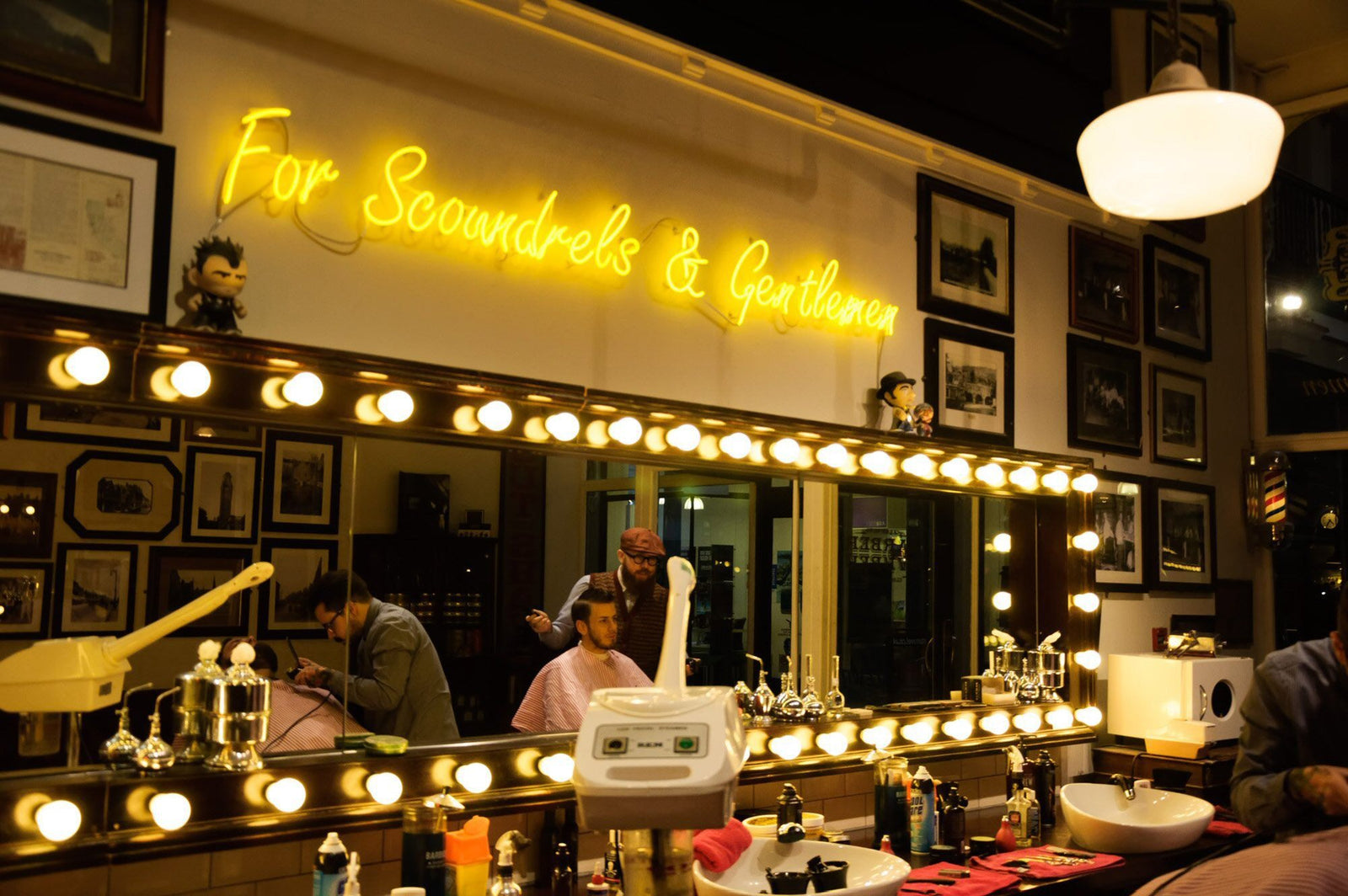 For Scoundrels & Gentlemen' yellow neon sign. Real glass neon fitted directly onto the wall.