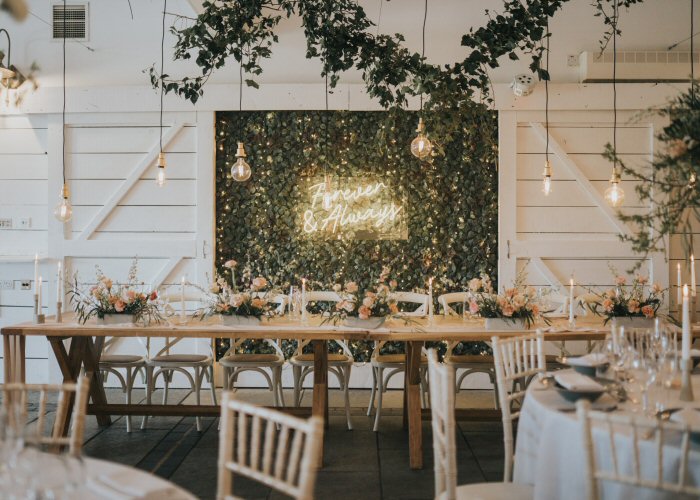 Forever & Always' white neon sign. Real glass neon mounted on clear acrylic panel.