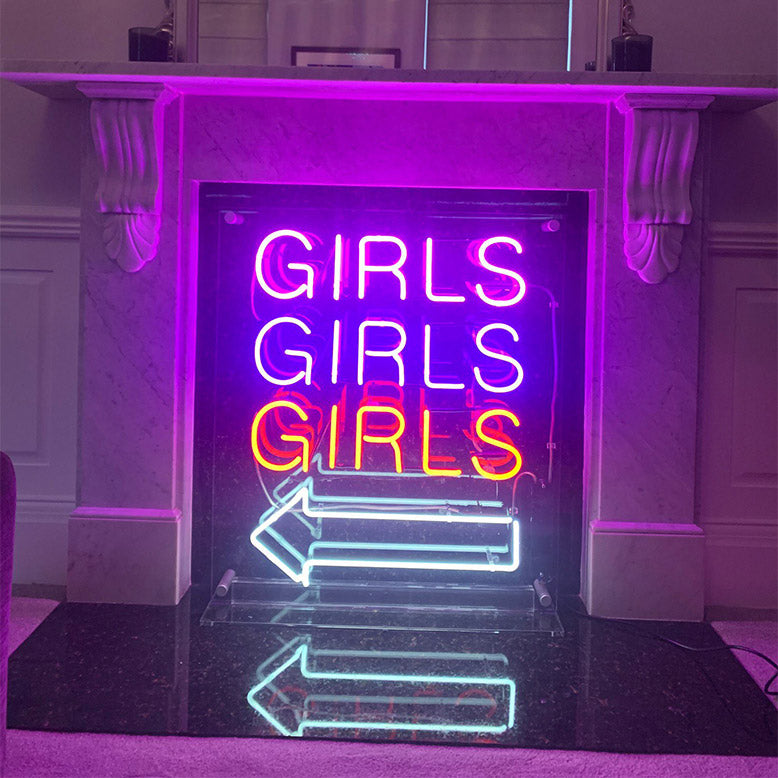 GIRLS GIRLS GIRLS' neon sign for home. Real glass neon on a free standing clear acrylic panel.