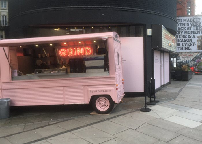GRIND' pink neon sign. Real glass neon fitted inside clear acrylic case.
