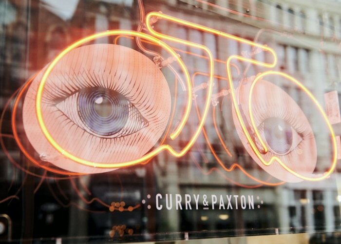 Glasses' red neon sign. Real glass neon fitted inside acrylic case with printed back.