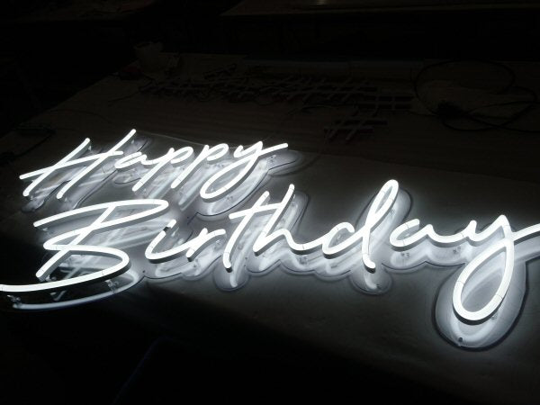 Happy Birthday' white LED sign. NeonPlus LED fitted onto cut to shape clear panel.