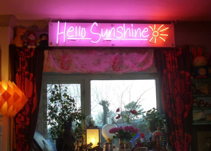 Hello Sunshine' magenta and amber neon sign. Real glass neon on a satin white acrylic panel.