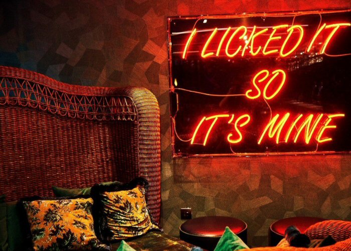 I LICKED IT SO IT'S MINE' orange neon sign. Real glass neon fitted inside clear acrylic case with printed back.