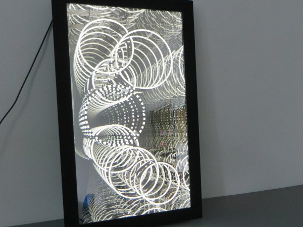 Circles' white neon infinity box. Real glass neon fitted into an infinity box.