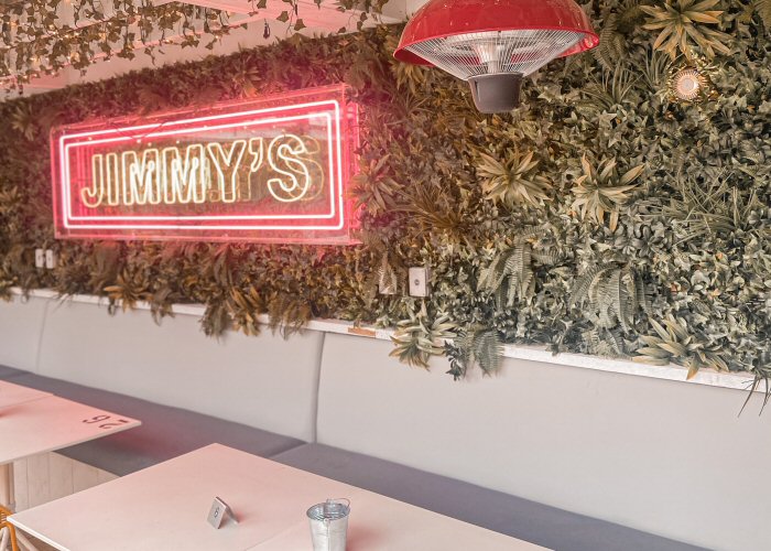 JIMMY'S' pink and green neon sign. Real glass neon fitted inside clear acrylic case.