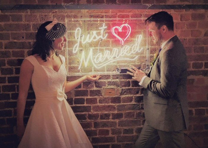 Just Married' white and pink neon sign. Real glass neon fitted inside clear acrylic case.