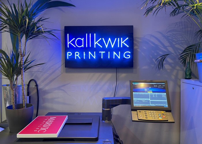 kallkwik PRINTING' blue neon sign. Real glass neon mounted on to reclaimed wooden panel.