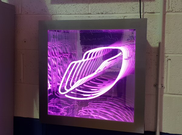 Lips' pink neon infinity box. Real glass neon fitted into an infinity box.