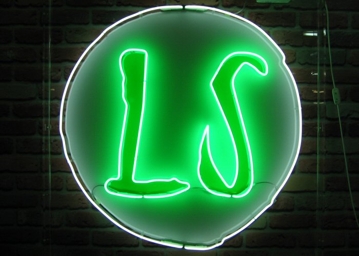 LS logo' white and green neon sign. Real glass neon fitted inside acrylic cases with clear back.