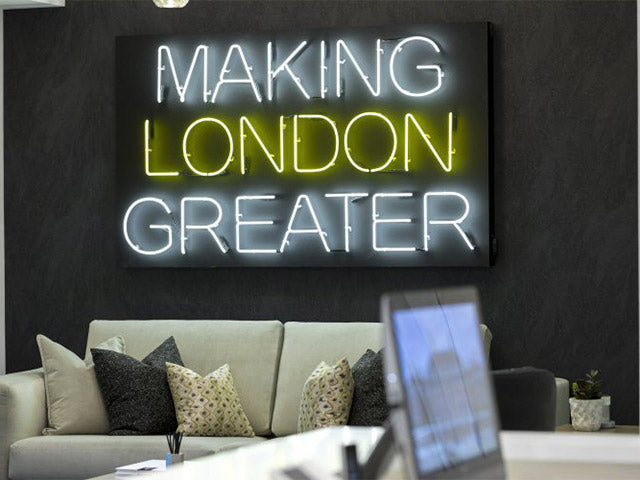 MAKING LONDON GREATER' white and yellow neon sign. Real glass neon fitted onto the front of an all black acrylic case.