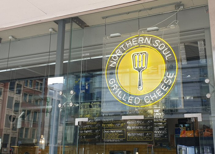 NORTHERN SOUL GRILLED CHEESE' white and yellow neon sign. Real glass neon fitted inside clear acrylic case.