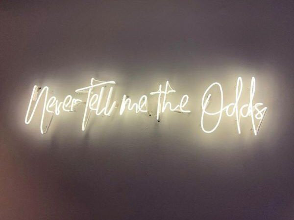 Never Tell me the Odds' white neon sign. Real glass neon fitted directly onto wall.