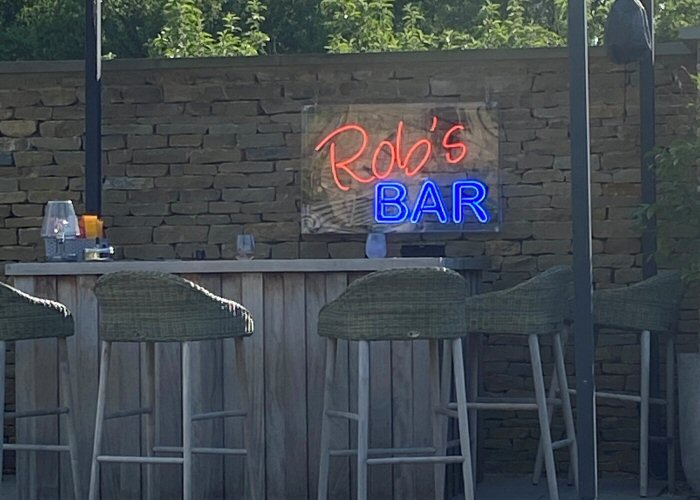 Rob's Bar' orange and blue neon sign. Real glass neon fitted inside clear polycarbonate case.