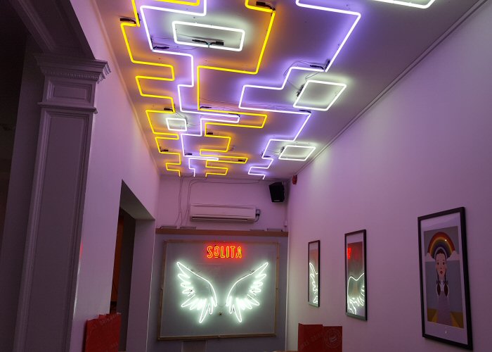 SoLita Chandelier' white neon artwork. Real glass neon fitted directly on to the ceiling.