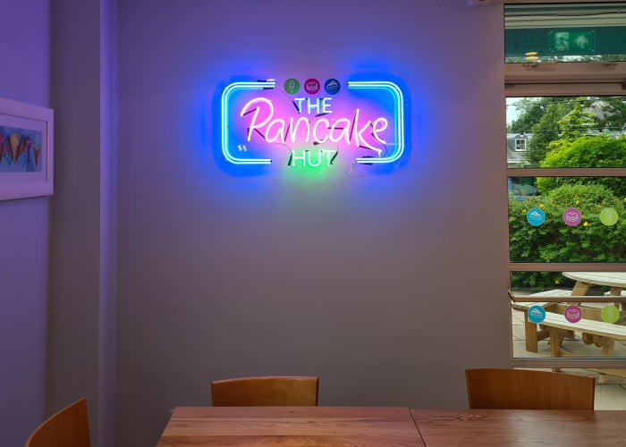 The Pancake Hut' multi-coloured neon sign. Real glass neon on a clear acrylic panel cut to shape.
