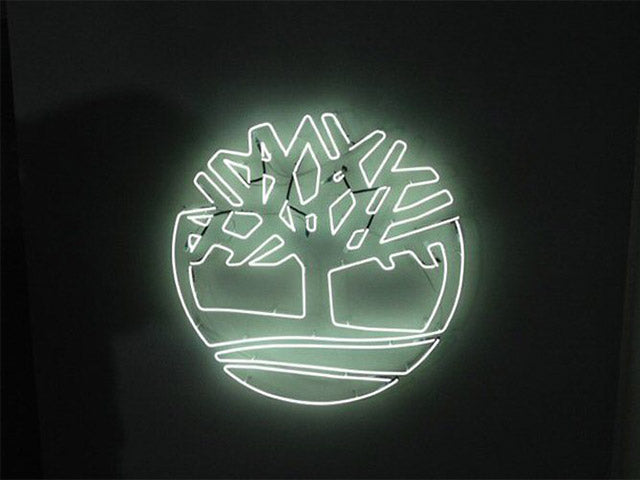 Timberland logo' white neon sign. Real glass neon fitted directly onto the wall.