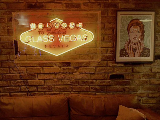 Welcome to Glass Vegas' red and yellow neon sign. Real glass neon fitted inside clear acrylic case.