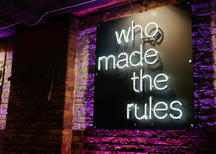 who made the rules' white neon sign. Real glass neon fitted directly onto satin black acrylic panel.