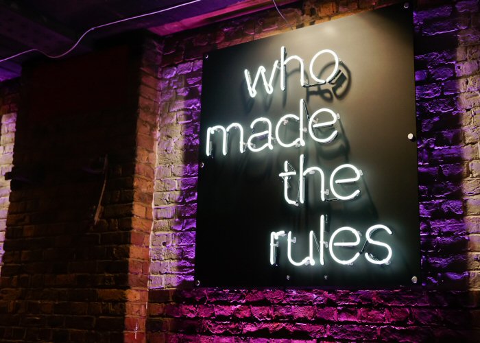 who made the rules' white neon sign. Real glass neon fitted directly onto satin black acrylic panel.