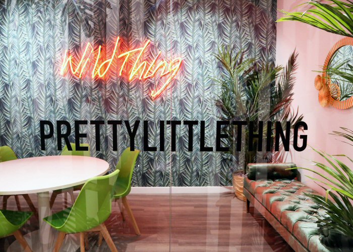 Wild Thing' orange neon sign. Real glass neon fitted directly onto wall.