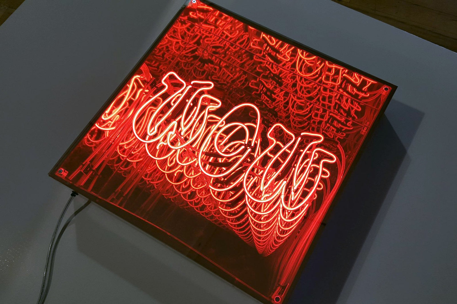 WOW' red neon infinity box. Real glass neon fitted into an infinity box.