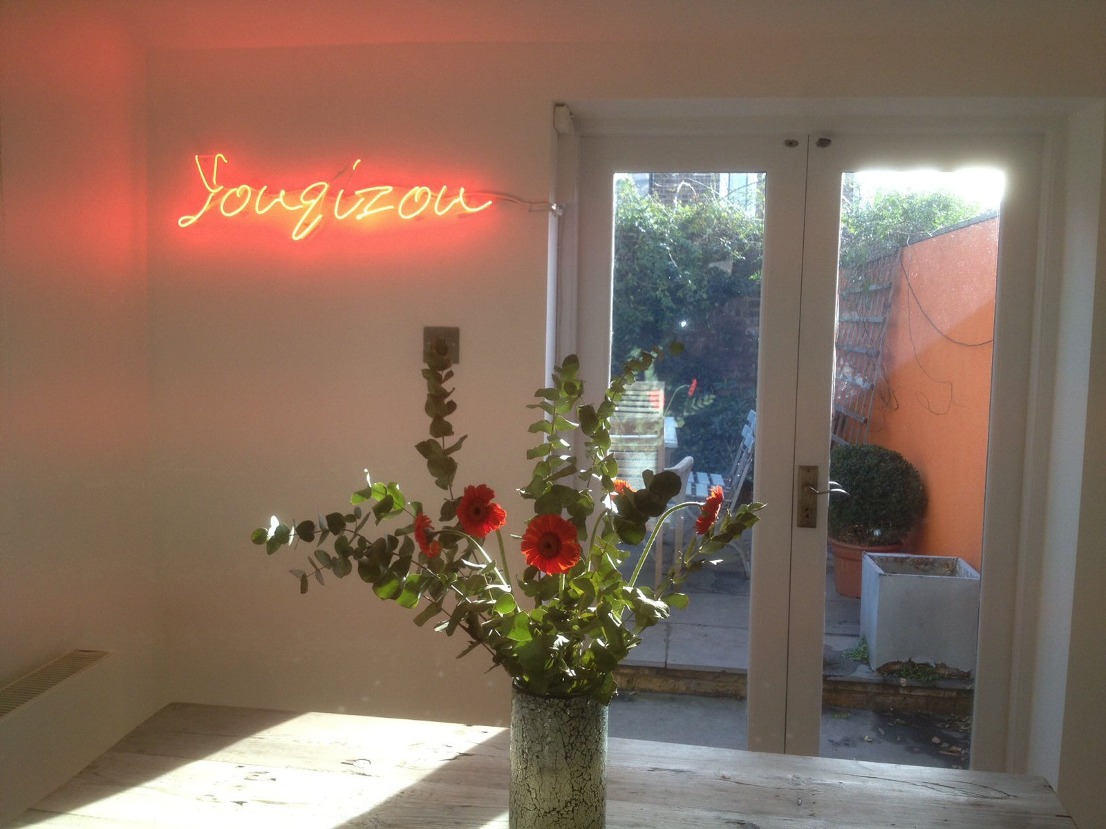 Youqizou' red neon sign. Real glass neon fitted directly onto wall.