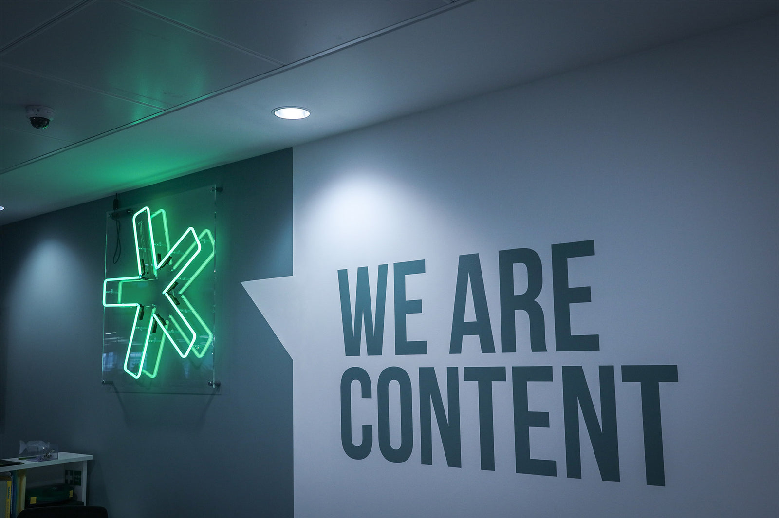 Asterisk' green neon sign. Real glass neon on a clear acrylic panel.