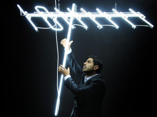 Antenna' white neon artwork. Real glass neon fitted to clear cut out acrylic shape.