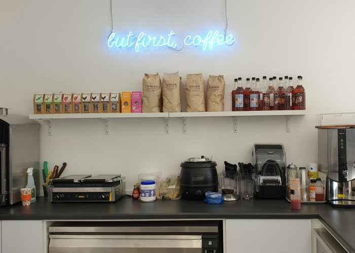 but first, coffee' blue neon sign. Real glass neon fitted directly onto wall.