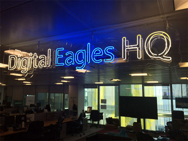 Digital Eagles HQ' white and blue neon sign. Real glass neon on a clear acrylic panel cut to shape.