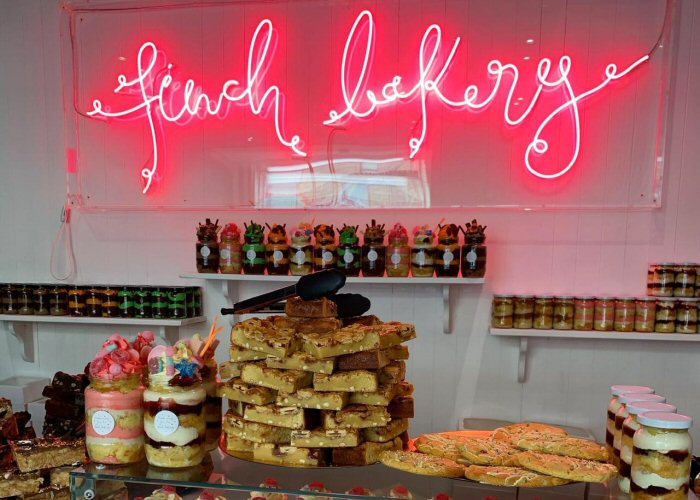Finch Bakery' pink neon sign. Real glass neon fitted inside clear acrylic case.