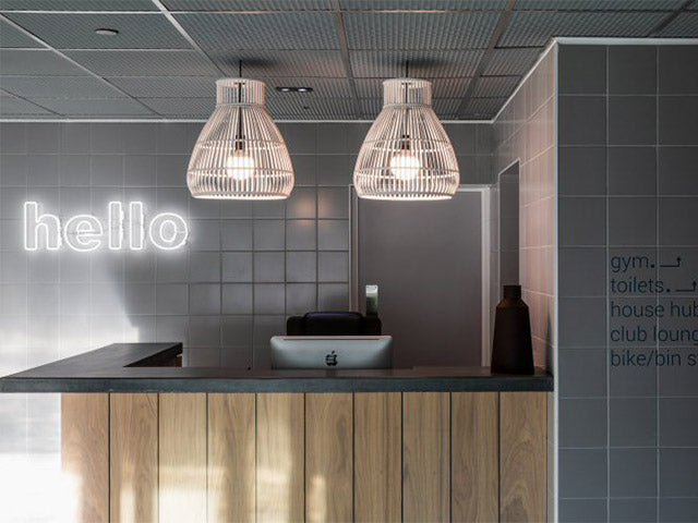 hello' white neon sign. Real glass neon fitted directly onto the wall.