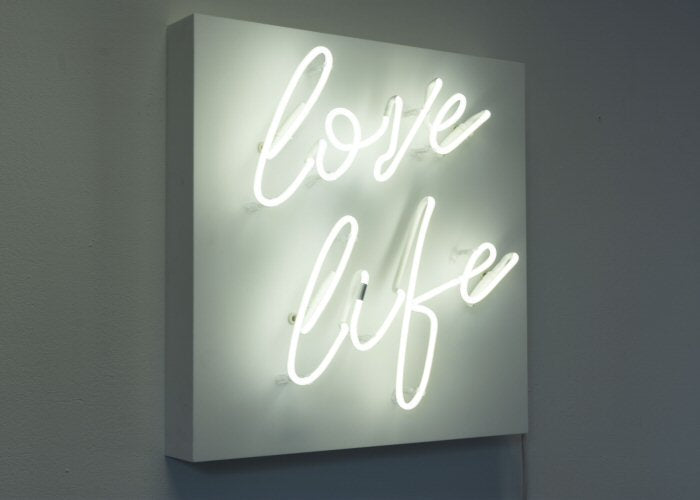 love life' white neon light. Real glass neon fitted onto front of white acrylic case.