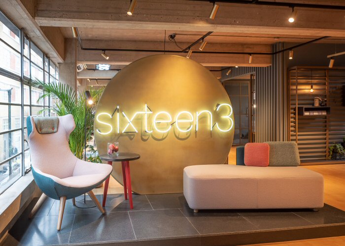 sixteen3' white neon sign. Real glass neon fitted onto client's own backing.