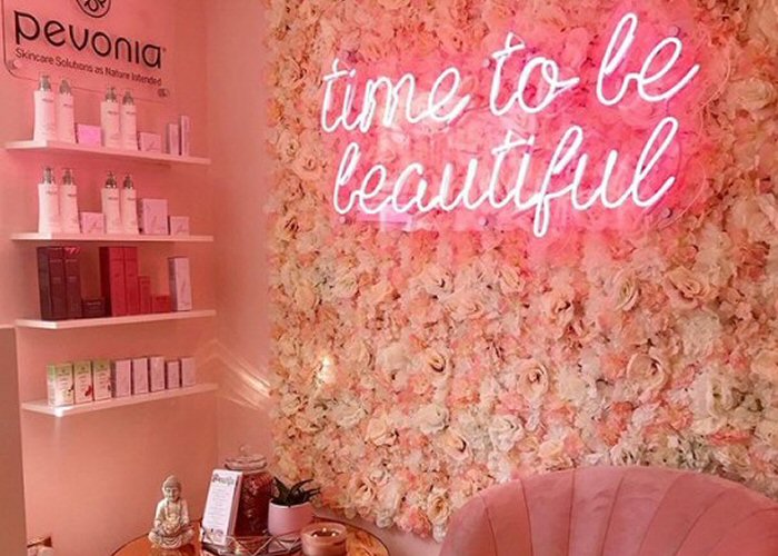 time to be beautiful' pink neon sign. Real glass neon on a clear acrylic panel cut to shape.
